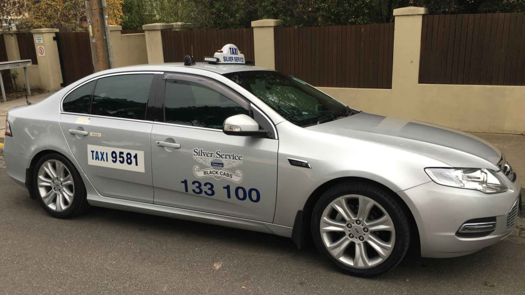 A silver car with the number 100 on it. Image representing Melbourne Silver Cabs, a reliable transportation service in Melbourne.